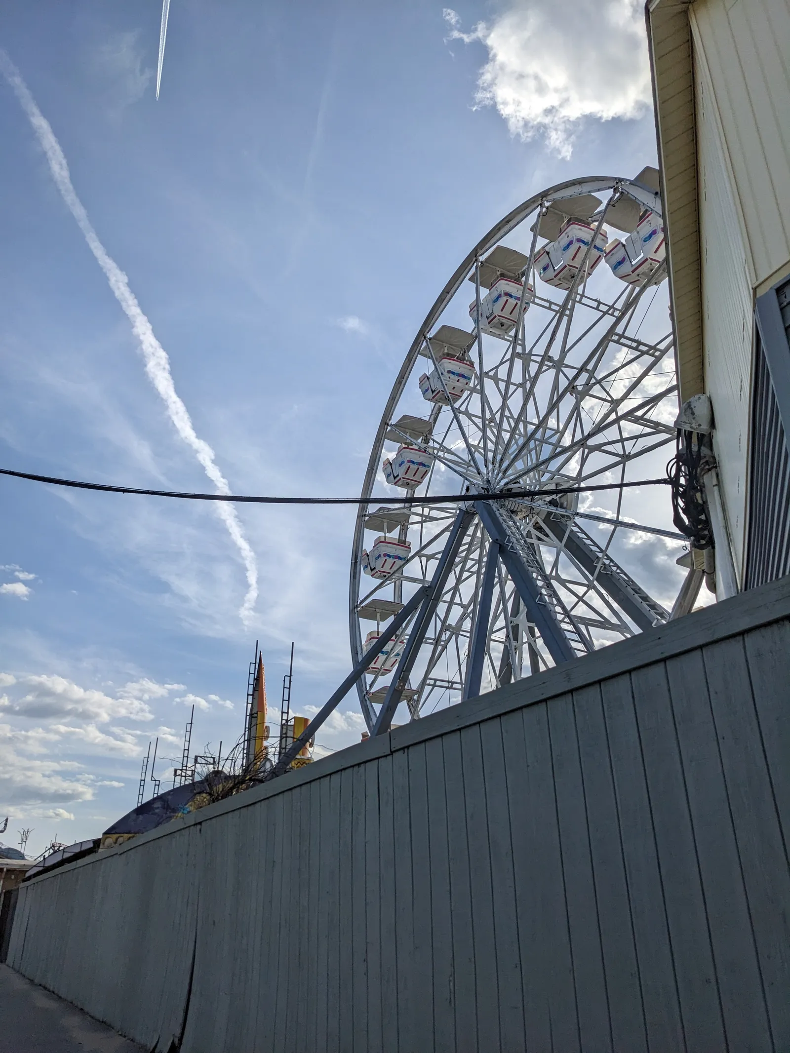 The Electra Wheel ferris wheel rising over Old Orchard Beach