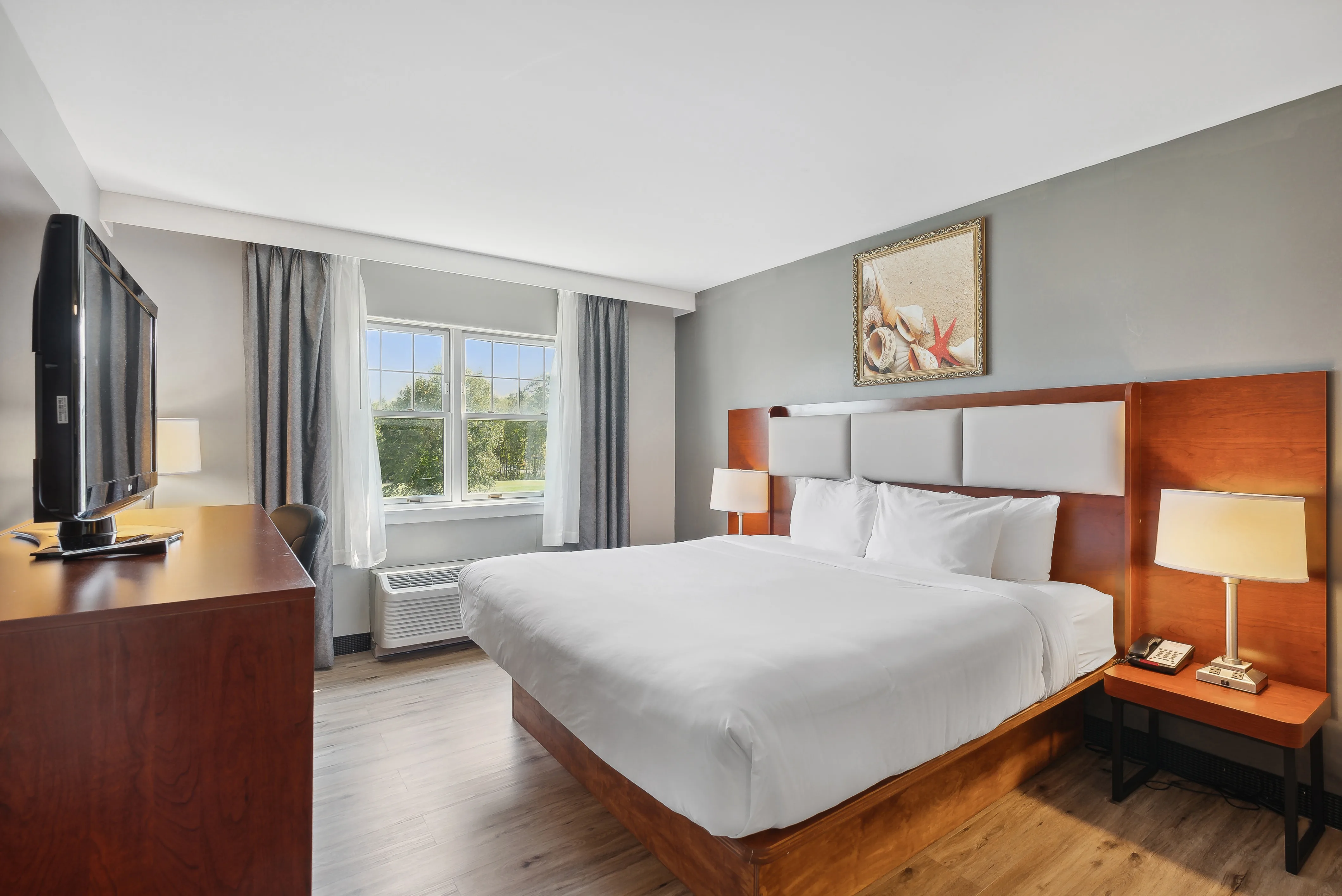 King bed guest room at Saco Bay Hotel